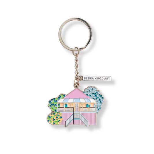Keychain with a colorful Queenslander house design on a white background