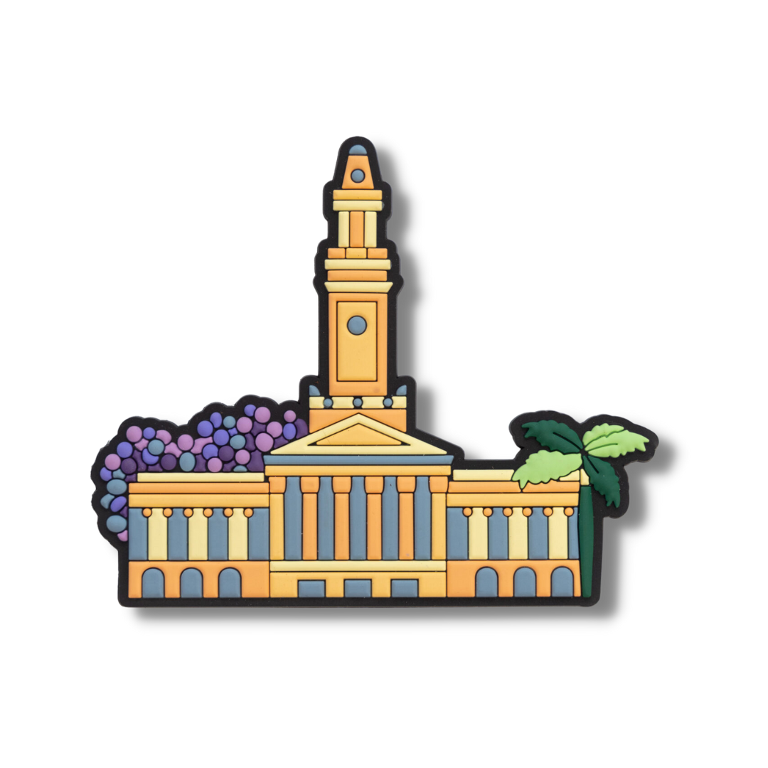 Rubber souvenir fridge magnet featuring image of Brisbane City Hall with palm and Jacaranda tree poking out from behind. Designed by Debra Hood.