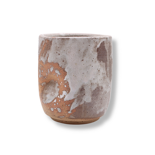 Ceramic cup with marbled design on a white background