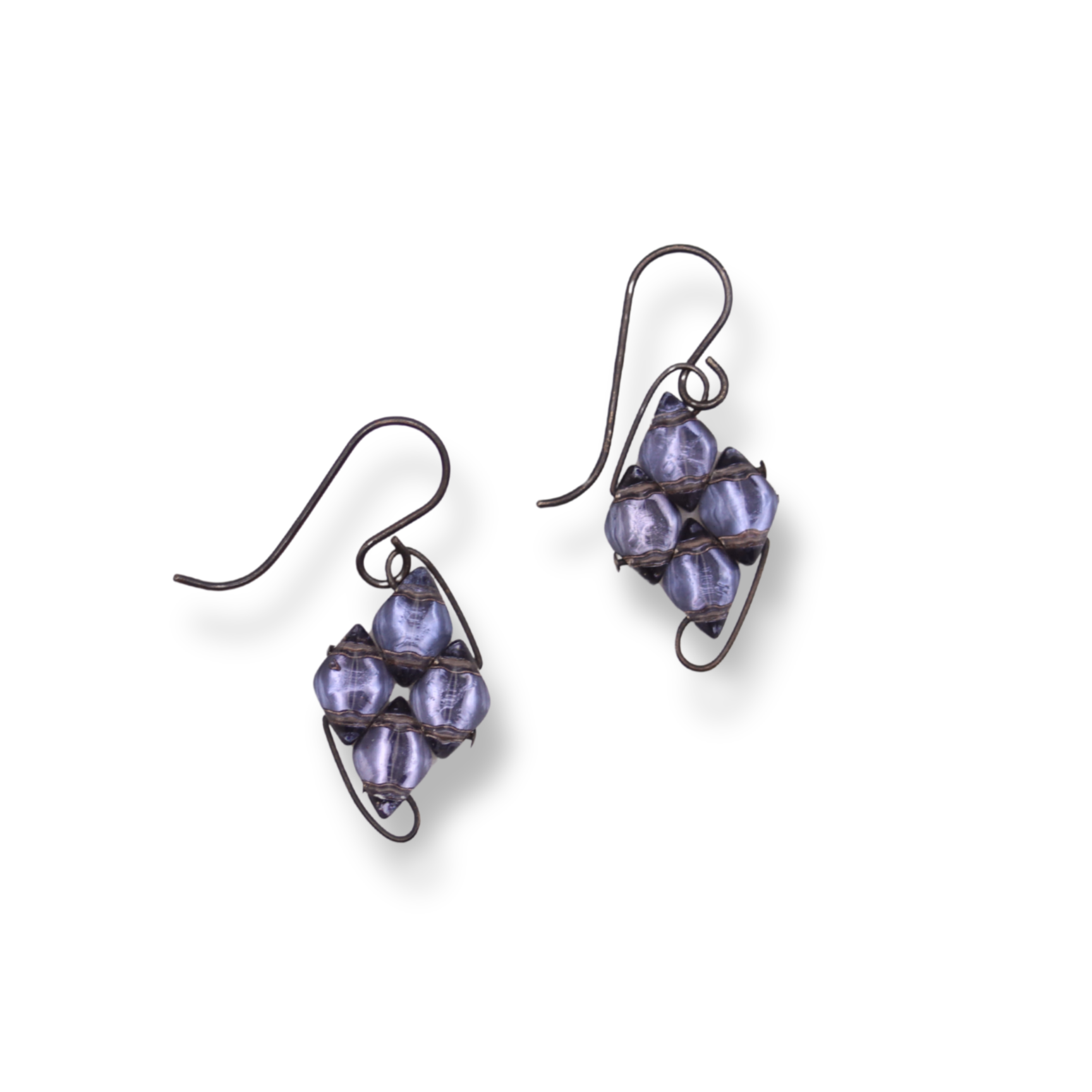 Pair of purple beaded earrings on a white background